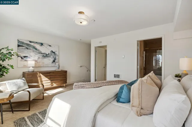 a bedroom with a bed and couch