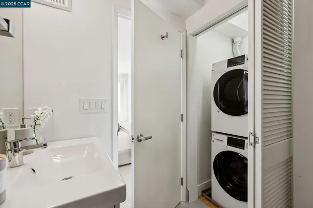 a bathroom with a sink and washing machine
