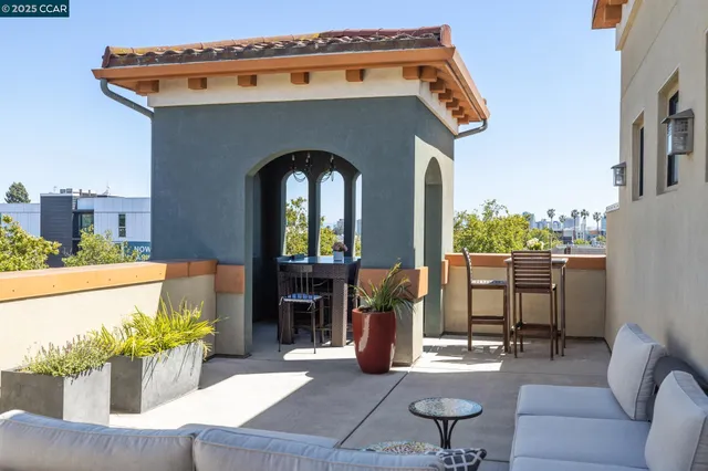 a front view of a house with outdoor seating