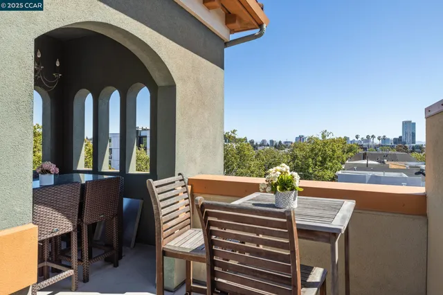 a view of a patio with table and chairs and wooden floor