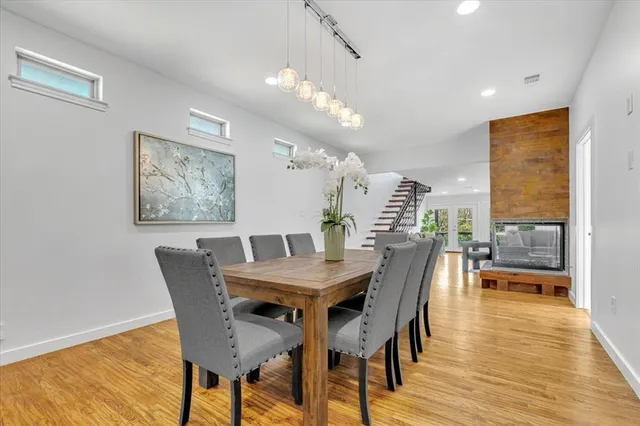 a spacious bedroom with a bed and a chandelier