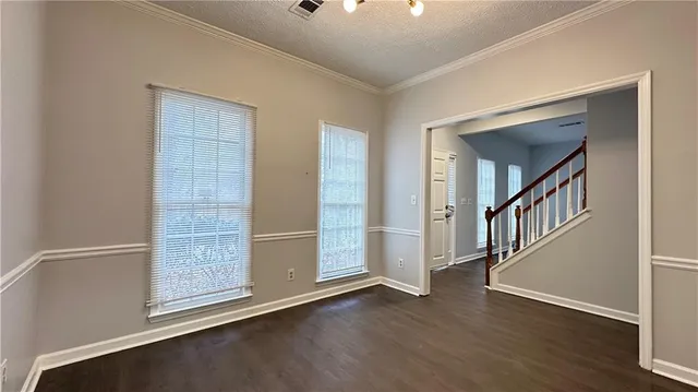 a view of an entryway with wooden floor