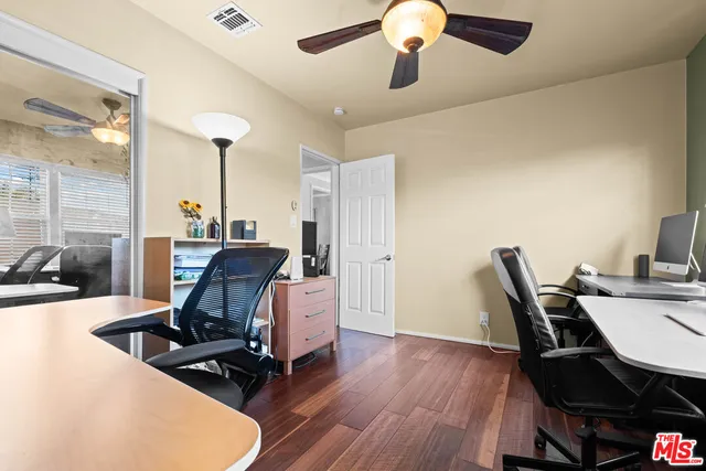 a workspace with furniture and wooden floor