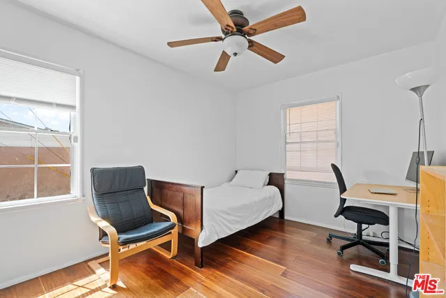 a bedroom with a workspace