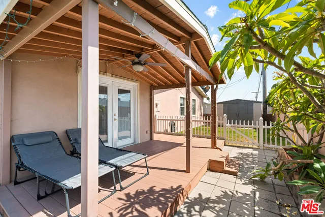 a balcony view with a seating space