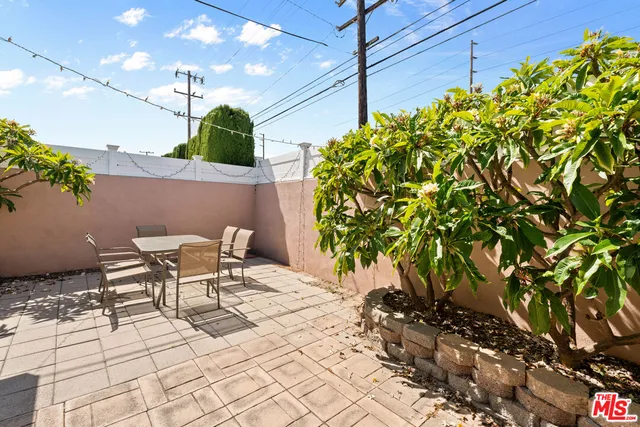 a view of a chairs and table in a patio