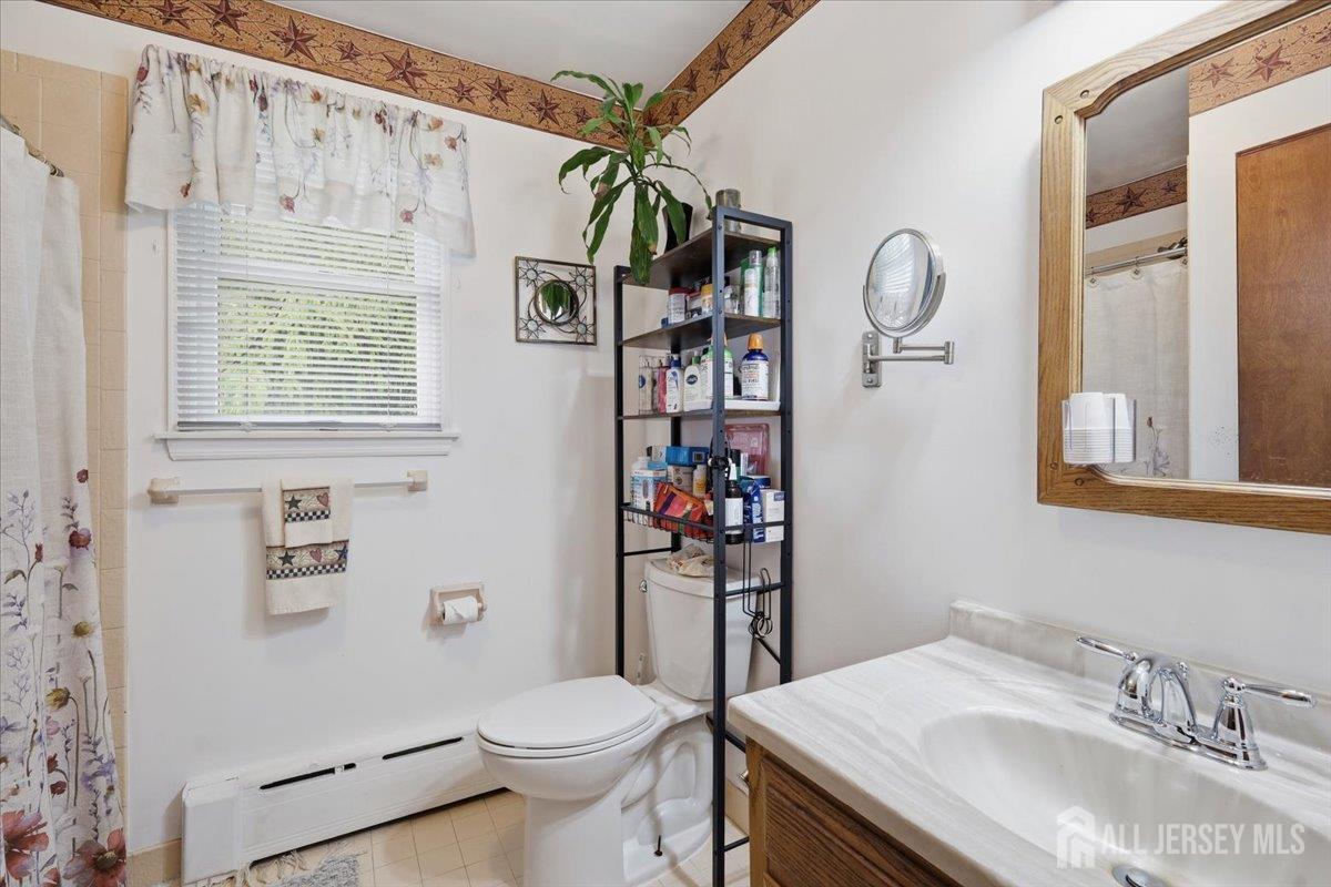 33 Ellison Road Somerset, NJ 08873 - Photo 15 of 38 a bathroom with a sink toilet and shower