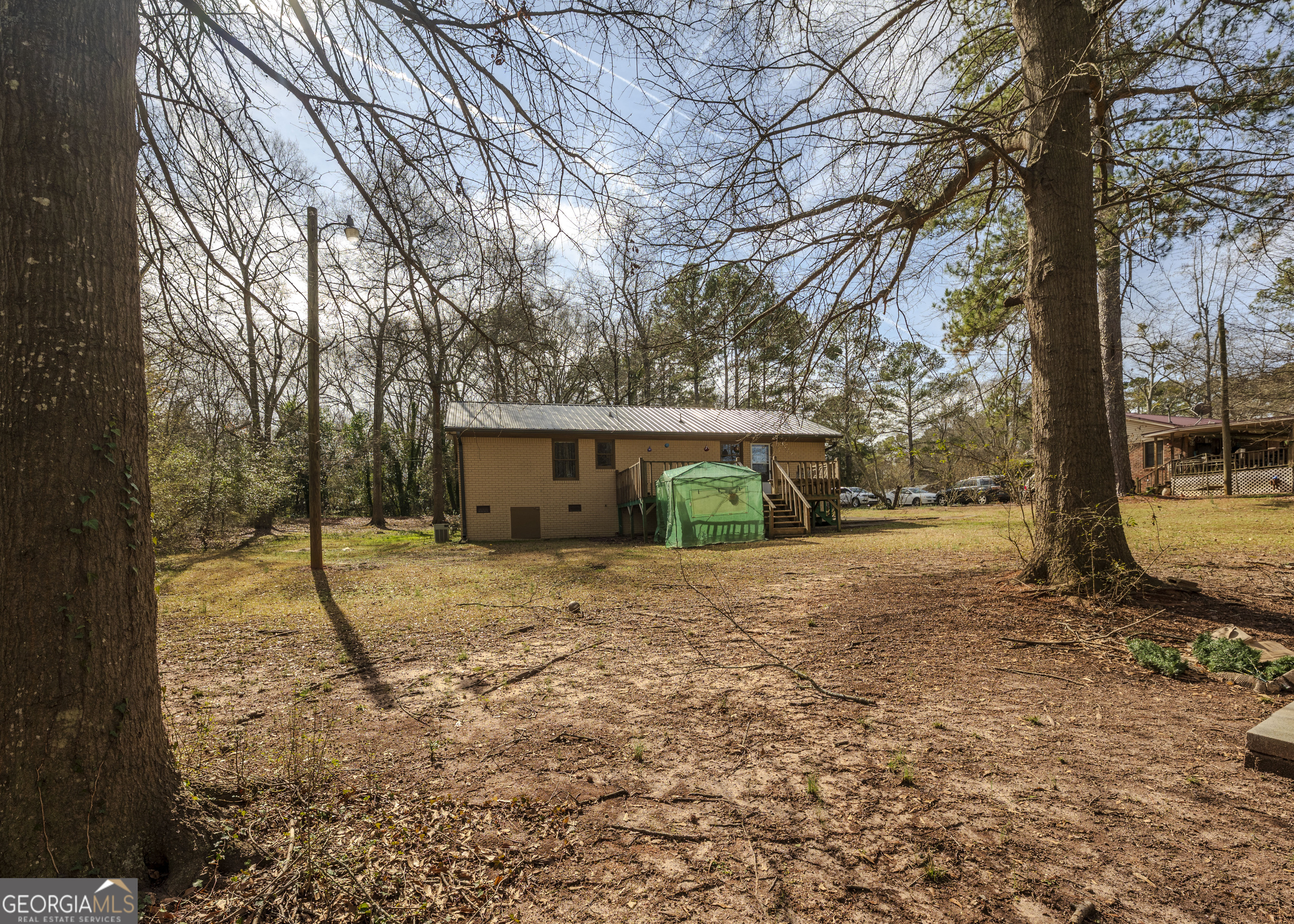 213 Ricefield Road Hartwell, GA 30643 - Photo 2 of 18 a house that has a tree in front of it