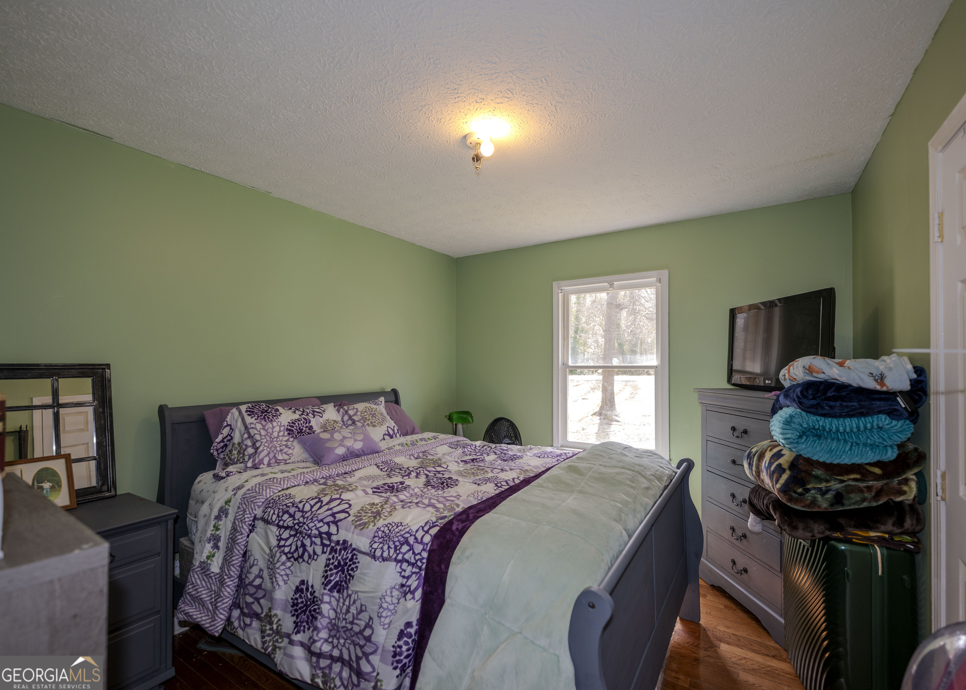 213 Ricefield Road Hartwell, GA 30643 - Photo 9 of 18 a bedroom with a bed dresser and a window