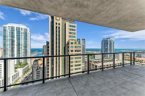 a view of a balcony with furniture