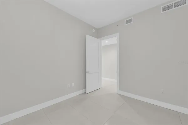 a view of a chair and tables in the balcony