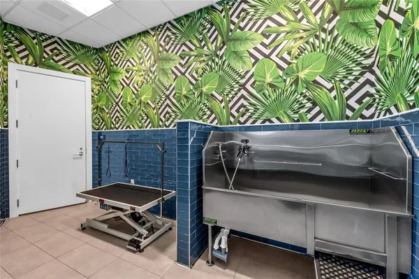 a kitchen with granite countertop sink and cabinets