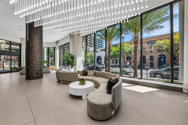 a living room with furniture and a large window