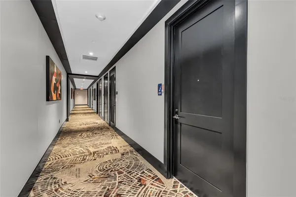 a kitchen that has a sink a stove and cabinets