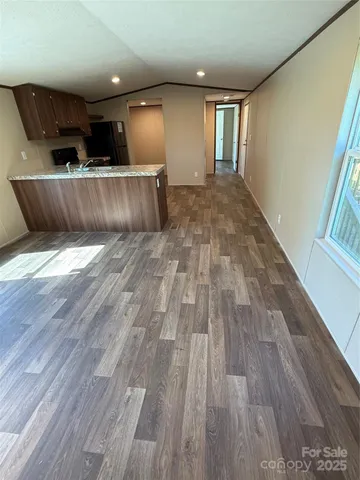 a view of kitchen and wooden floor