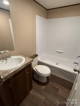 a view of gallery with wooden floor