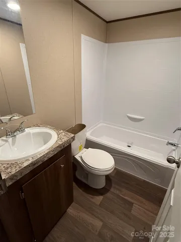 a view of gallery with wooden floor