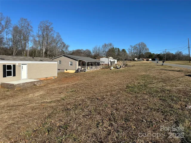 a street view with large trees