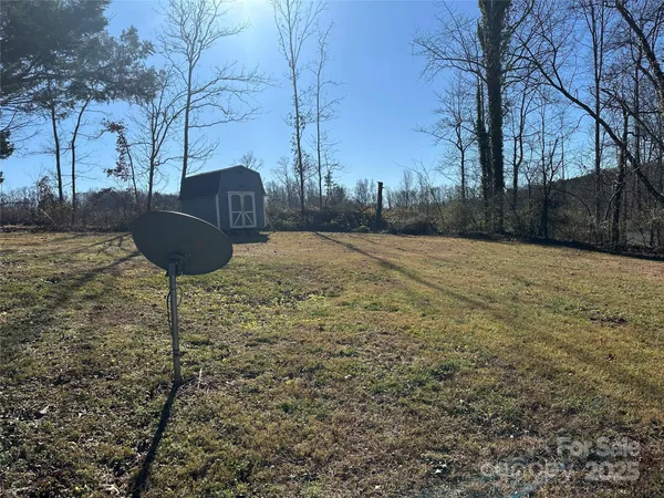 a kitchen with granite countertop wooden floors and stainless steel appliances