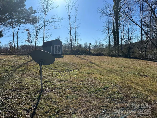 a kitchen with granite countertop wooden floors and stainless steel appliances