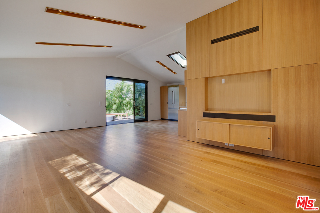 800 7th Avenue Venice, CA 90291 - Photo 5 of 28 a view of an empty room with wooden floor and a window