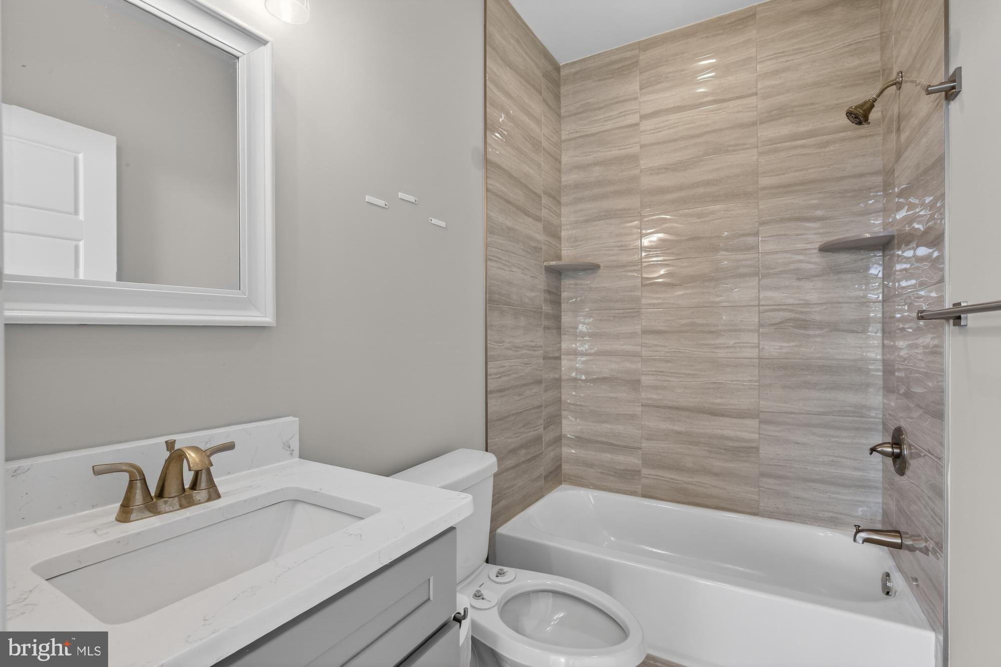 2034 North Front Street, Unit 3 Philadelphia, PA 19122 - Photo 19 of 29 a bathroom with a sink toilet and shower