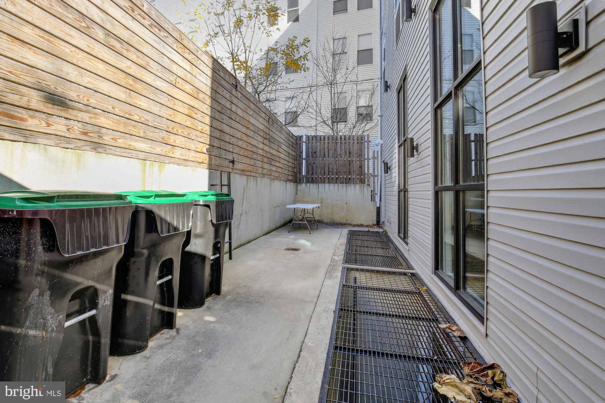 2034 North Front Street, Unit 3 Philadelphia, PA 19122 - Photo 26 of 29 a view of a balcony with wooden floor and iron stairs