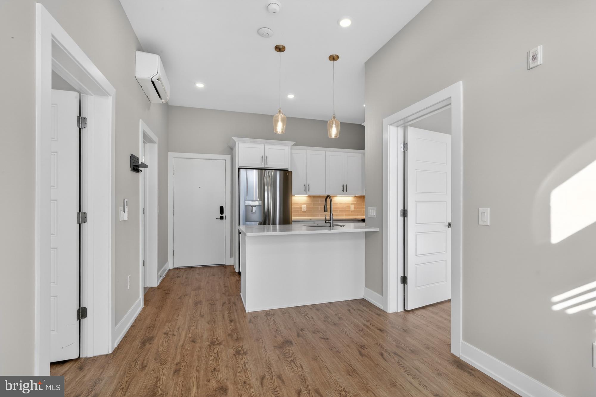 2034 North Front Street, Unit 3 Philadelphia, PA 19122 - Photo 8 of 29 a view of kitchen with wooden floor