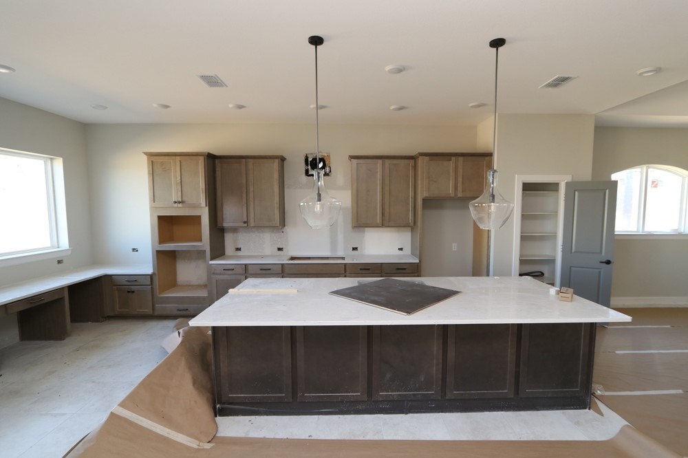6623 Dolomite Court Manvel, TX 77578 - Photo 6 of 13 a kitchen with a appliances sink and cabinets