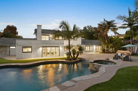 a view of a swimming pool with a patio
