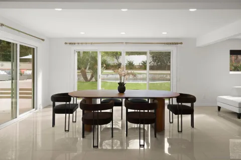 a view of a dining room with furniture window and outside view