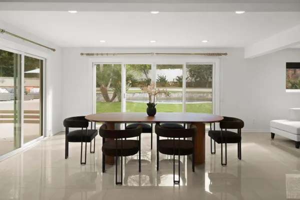 a view of a dining room with furniture window and outside view
