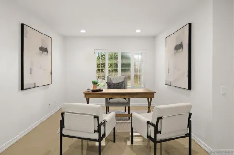 a workspace with furniture and window