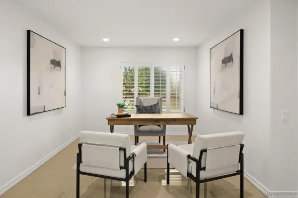 a workspace with furniture and window