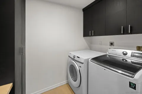 a bathroom with a double vanity sink a mirror and shower