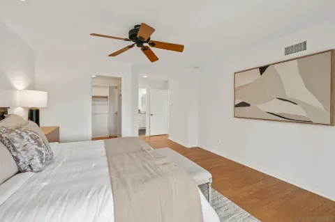a bathroom with double vanity sinks and a mirror