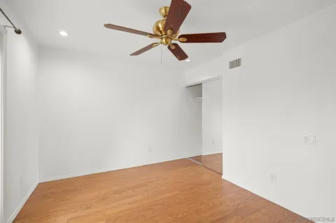 a bathroom with double sink and a window