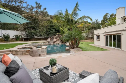 a view of outdoor dining space with a table and chairs