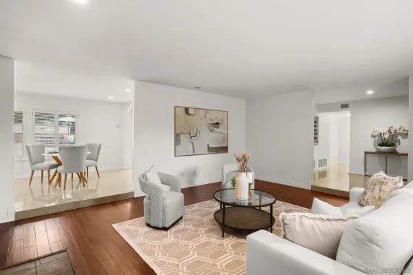 a living room with furniture and a table