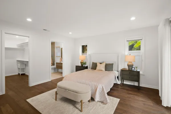 a bedroom with a bed and a couch