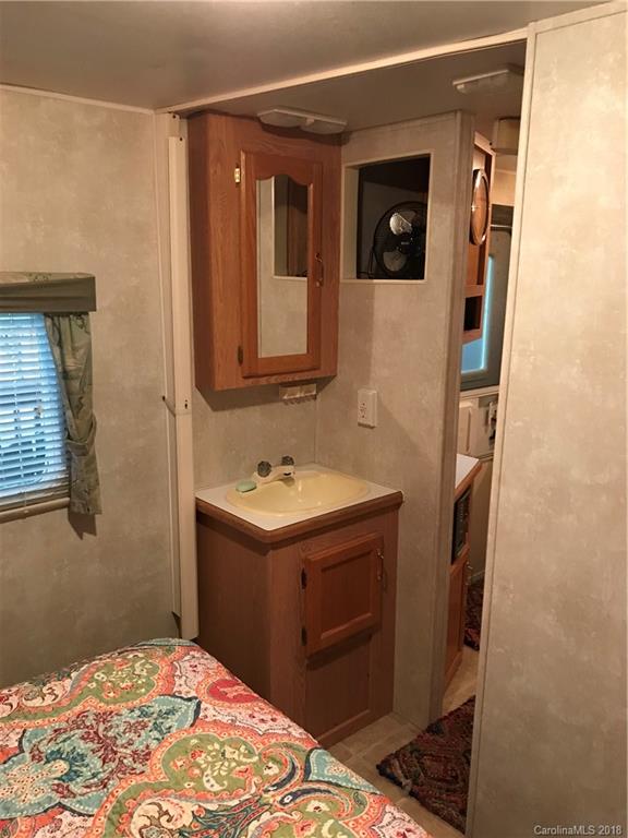 178 Roberts Ridge Road, Unit H34 Mount Gilead, NC 27306 - Photo 14 of 34 a bathroom with a sink and a mirror