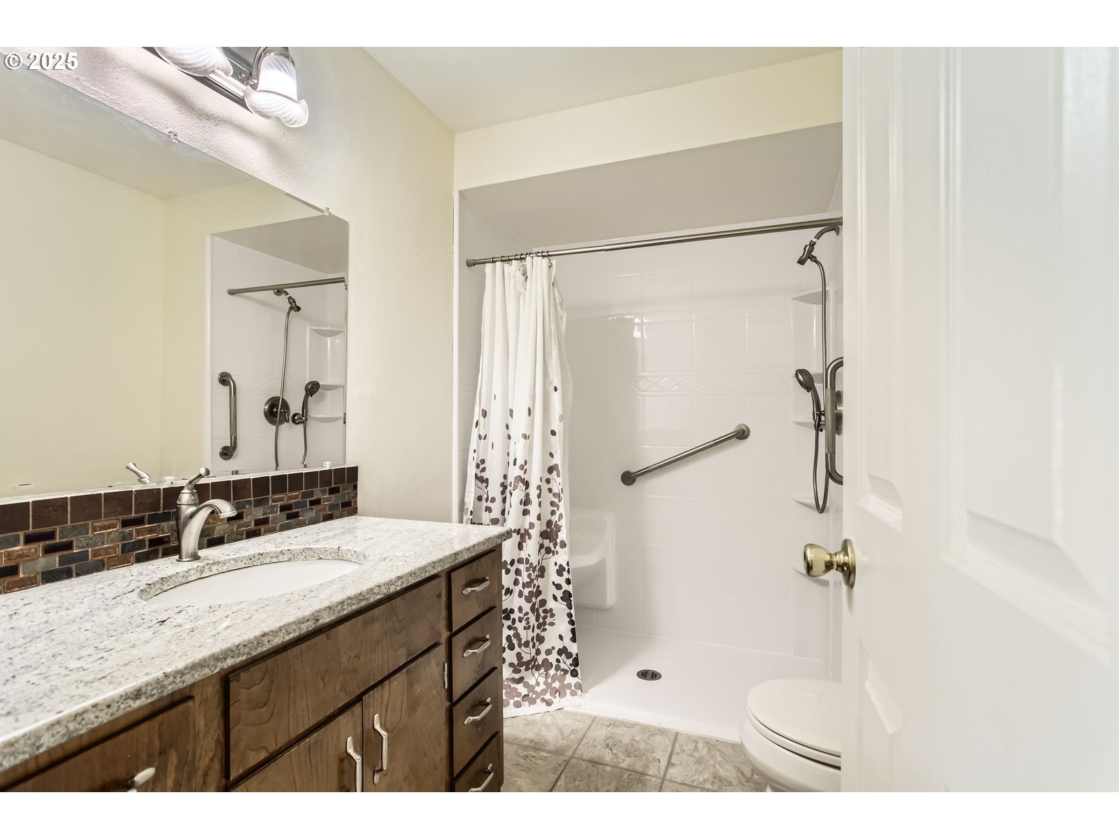 220 Northeast Village Squire Avenue, Unit 12 Gresham, OR 97030 - Photo 15 of 29 a bathroom with a granite countertop sink a mirror a vanity and shower