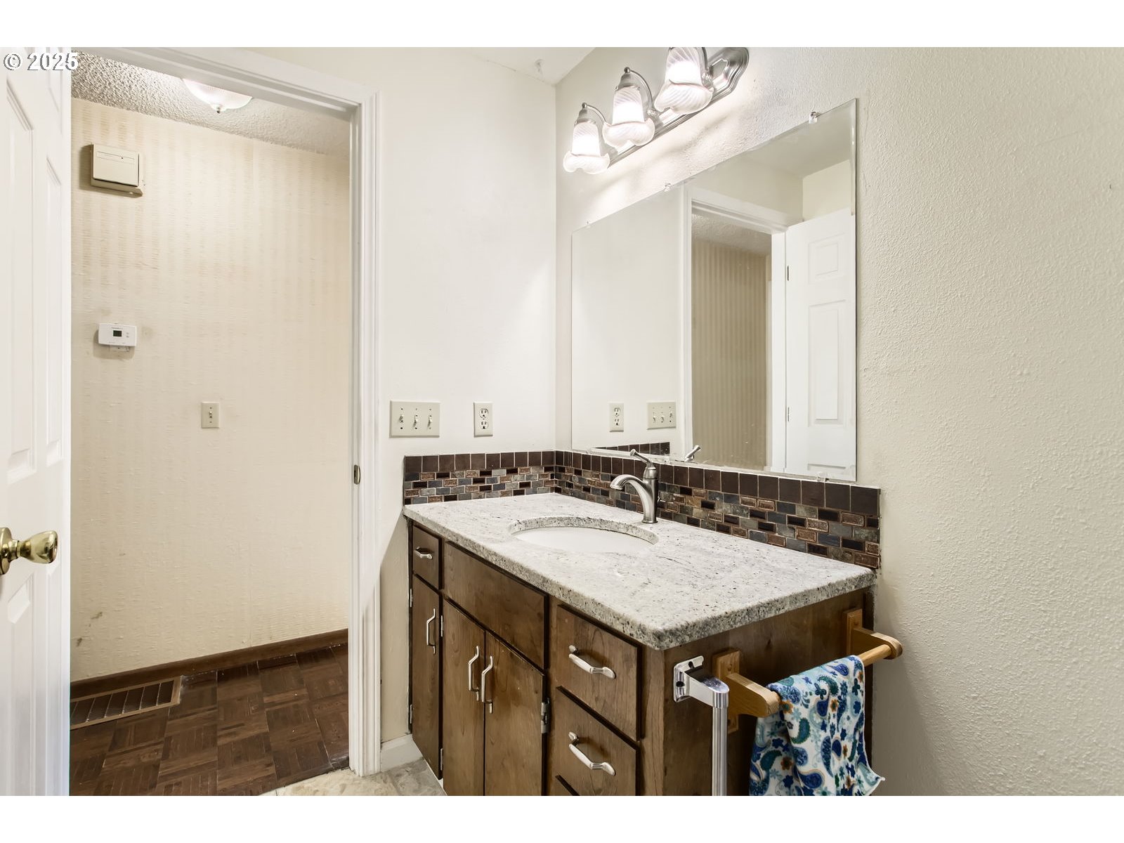 220 Northeast Village Squire Avenue, Unit 12 Gresham, OR 97030 - Photo 16 of 29 a bathroom with a sink and a mirror