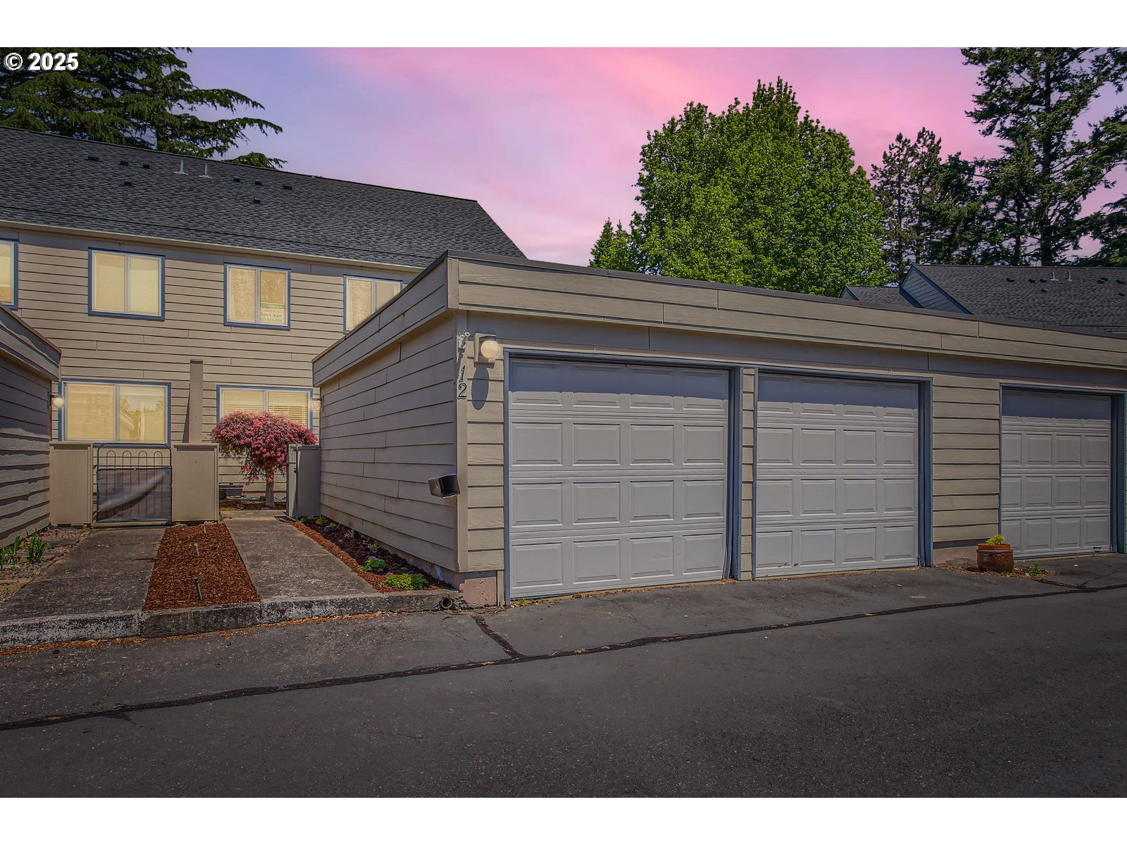 220 Northeast Village Squire Avenue, Unit 12 Gresham, OR 97030 - Photo 2 of 29 a view of a house with a yard