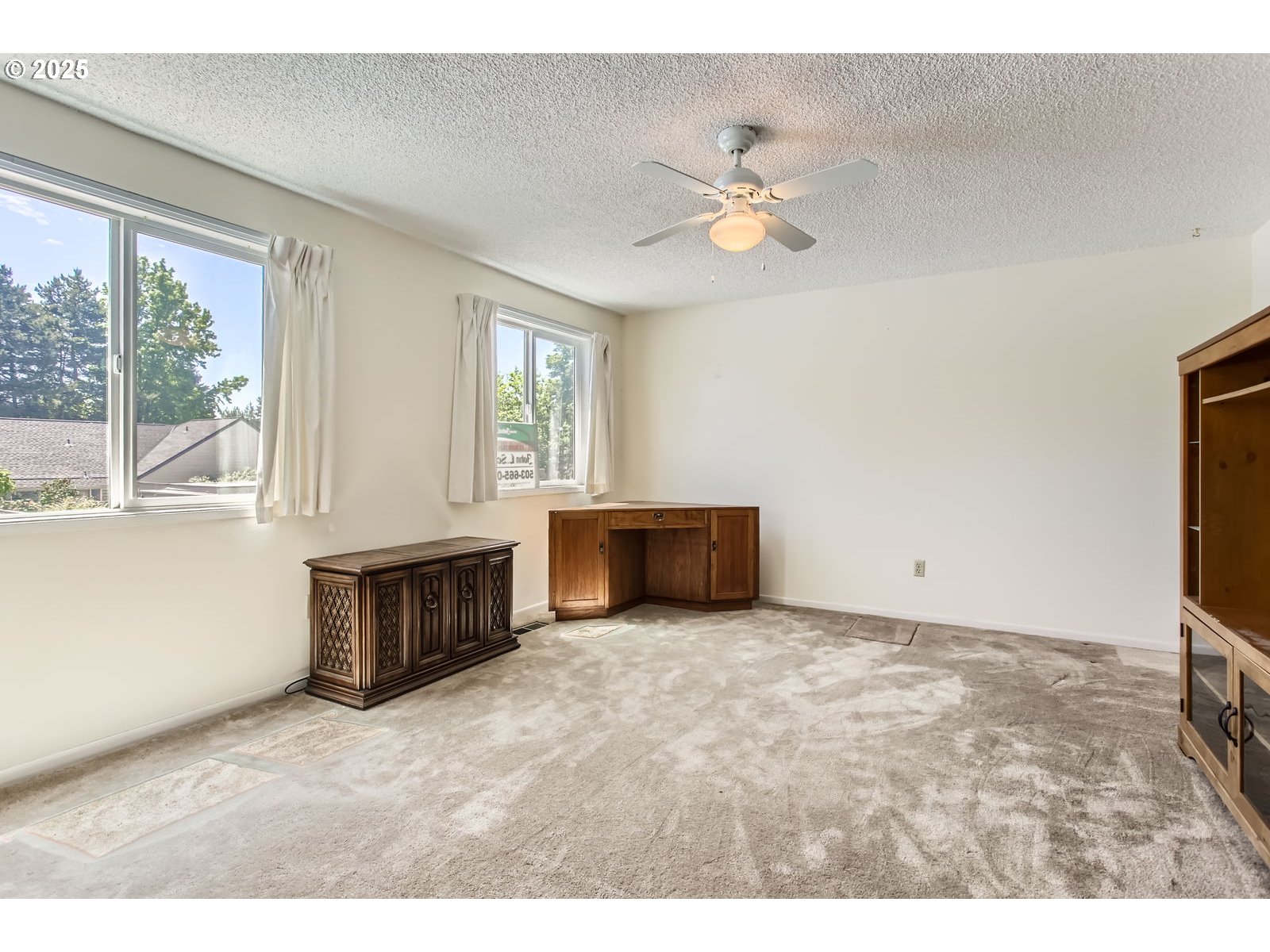 220 Northeast Village Squire Avenue, Unit 12 Gresham, OR 97030 - Photo 23 of 29 a view of an empty room with a window