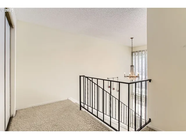 a kitchen with cabinets and window