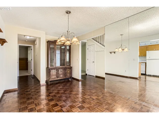 a view of a livingroom with wooden floor