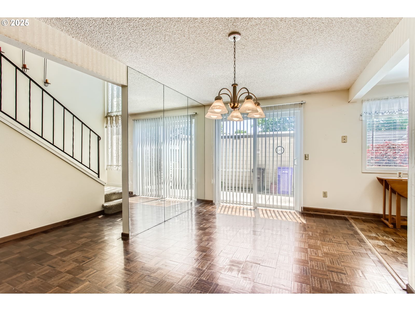 220 Northeast Village Squire Avenue, Unit 12 Gresham, OR 97030 - Photo 9 of 29 a view of a livingroom with wooden floor