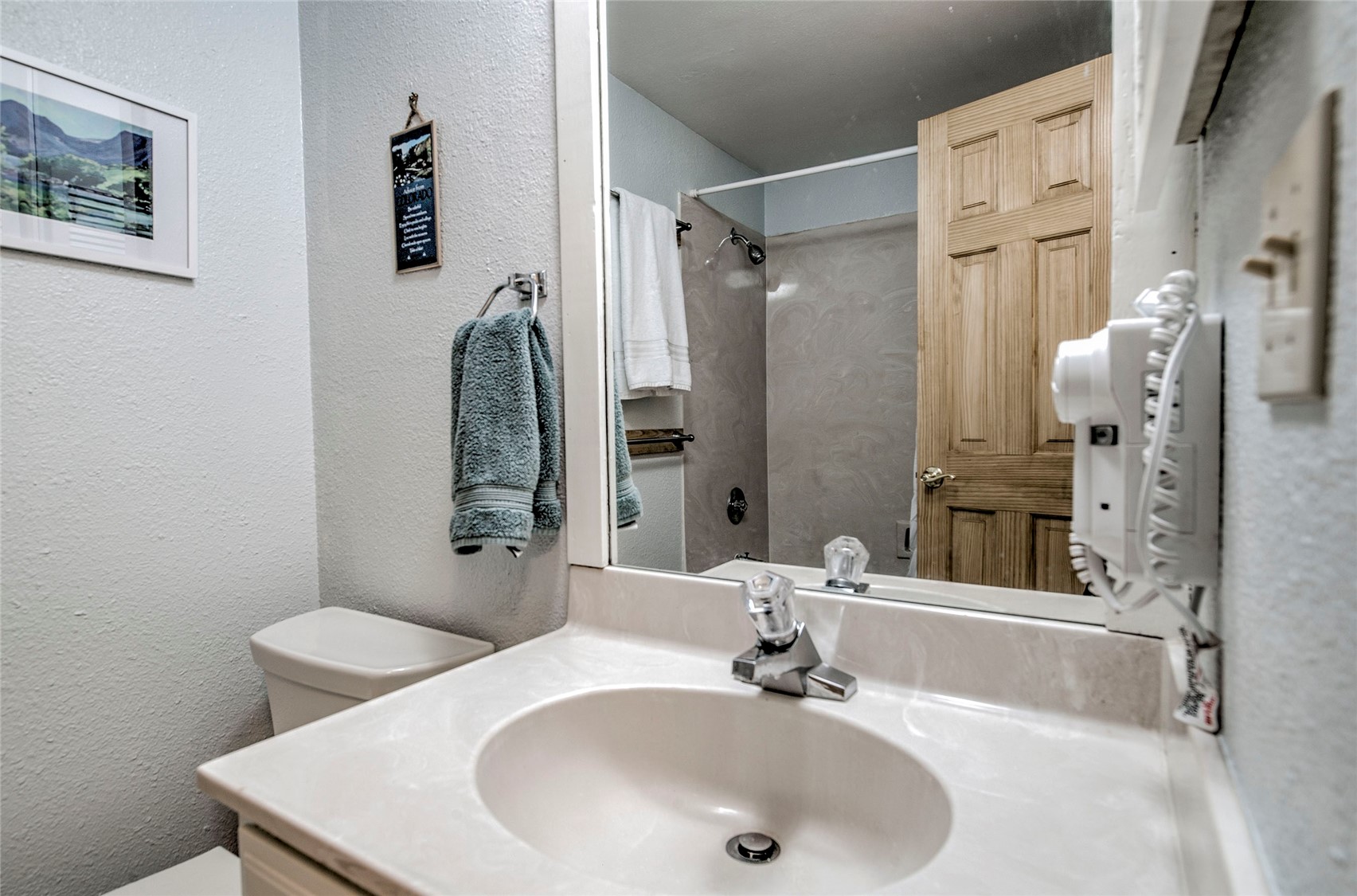 187 Fuller Placer Road, Unit B Breckenridge, CO 80424 - Photo 25 of 33 a bathroom with a sink toilet and shower