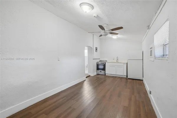 a kitchen with a refrigerator sink and stove